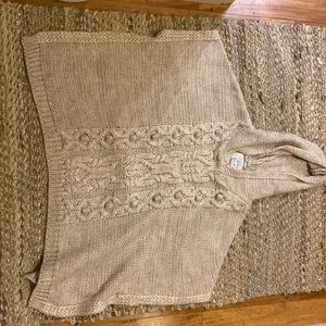 This sleek beige poncho for kids is perfect in any climate and basically new!!!!